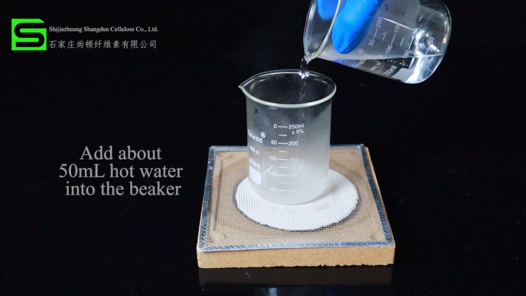 put hot water into the beaker